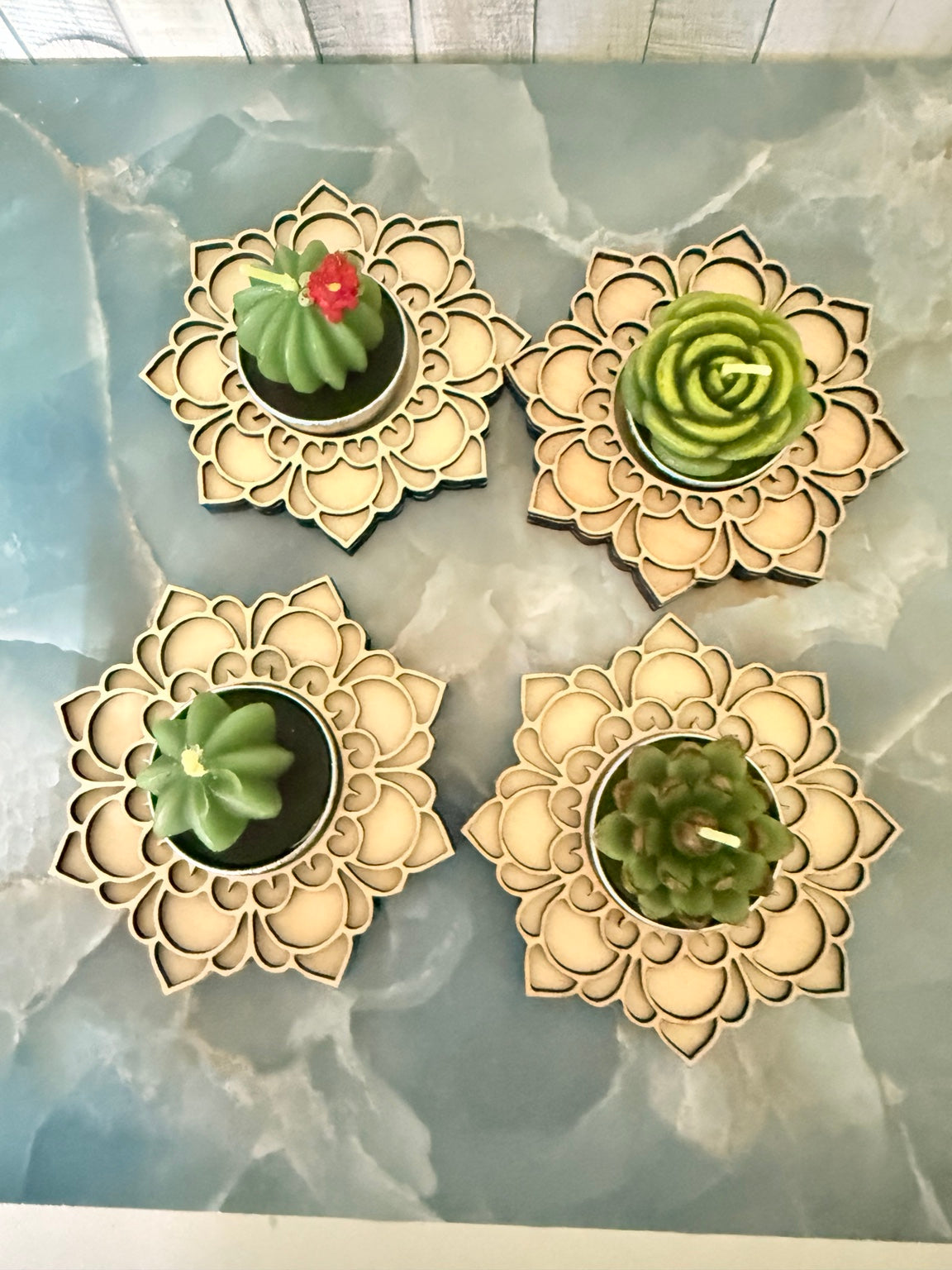 Birthday wooden mandala holders displaying assorted succulent candle upgrades; each purchase includes one holder and one candle