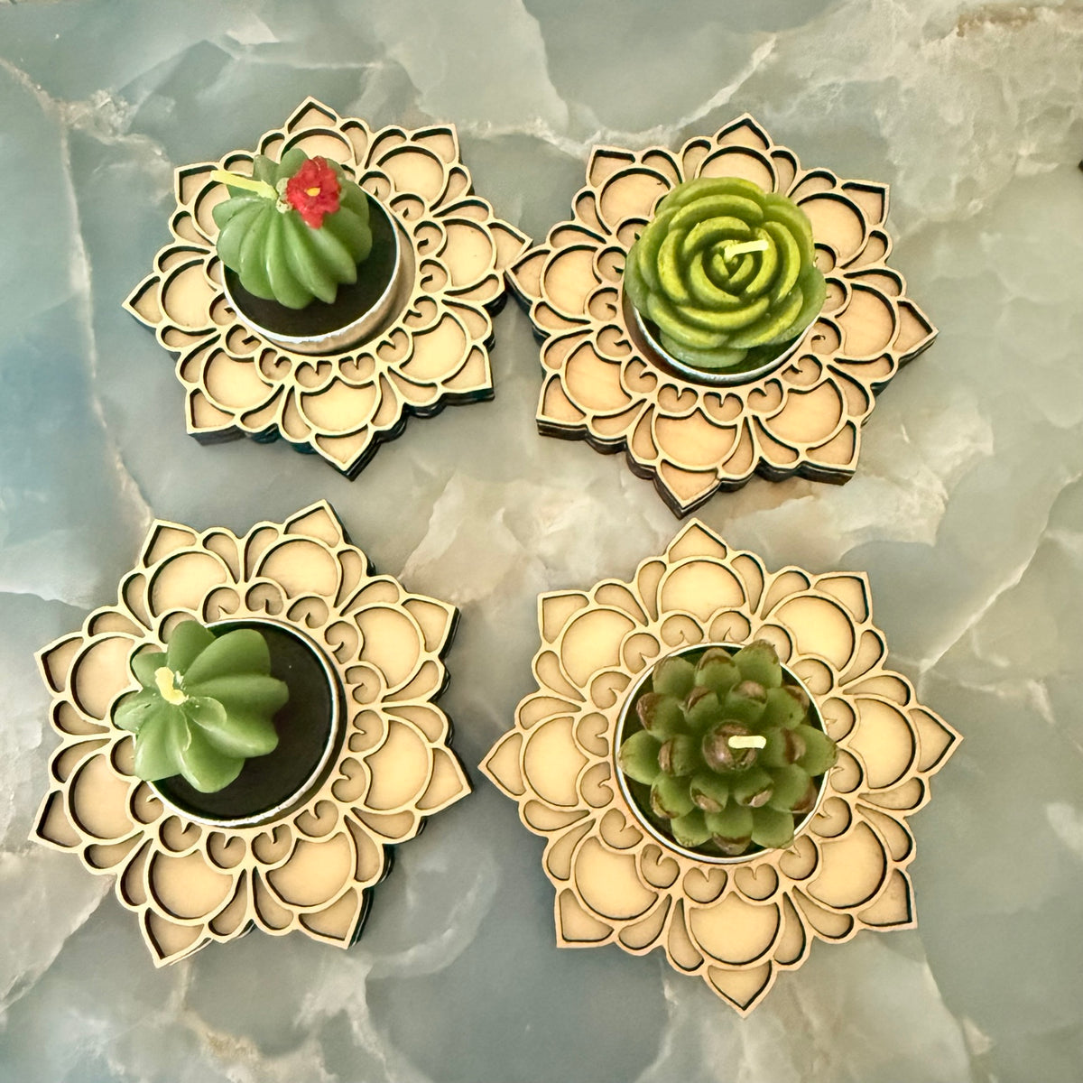 Birthday wooden mandala holders displaying assorted succulent candle upgrades; each purchase includes one holder and one candle