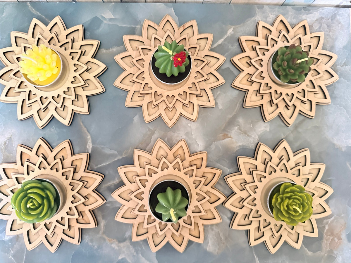 Wooden mandala holders displaying assorted succulent and cactus-shaped candle upgrades; each order includes one holder and one selected candle