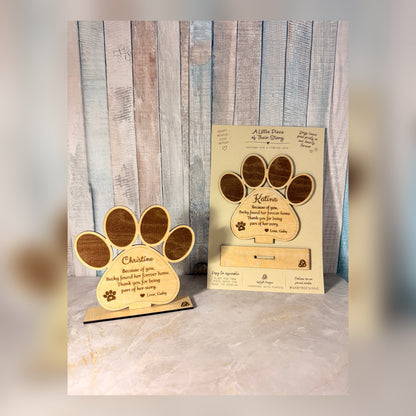 Personalized wooden dog paw keepsake with presentation card and display stand