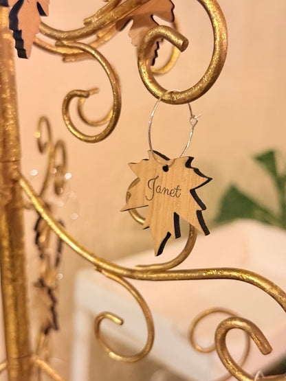 Maple leaf wine charm engraved with the name Janet
