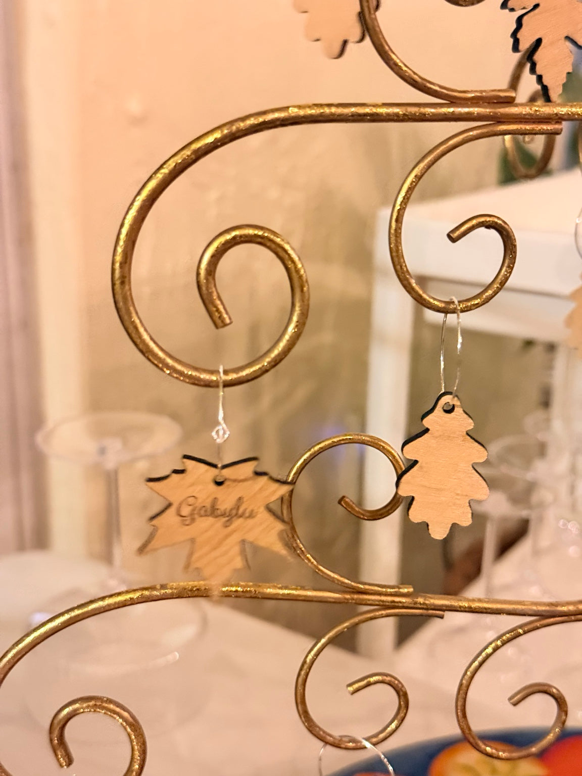 Maple and rounded oak wooden wine charms on a display