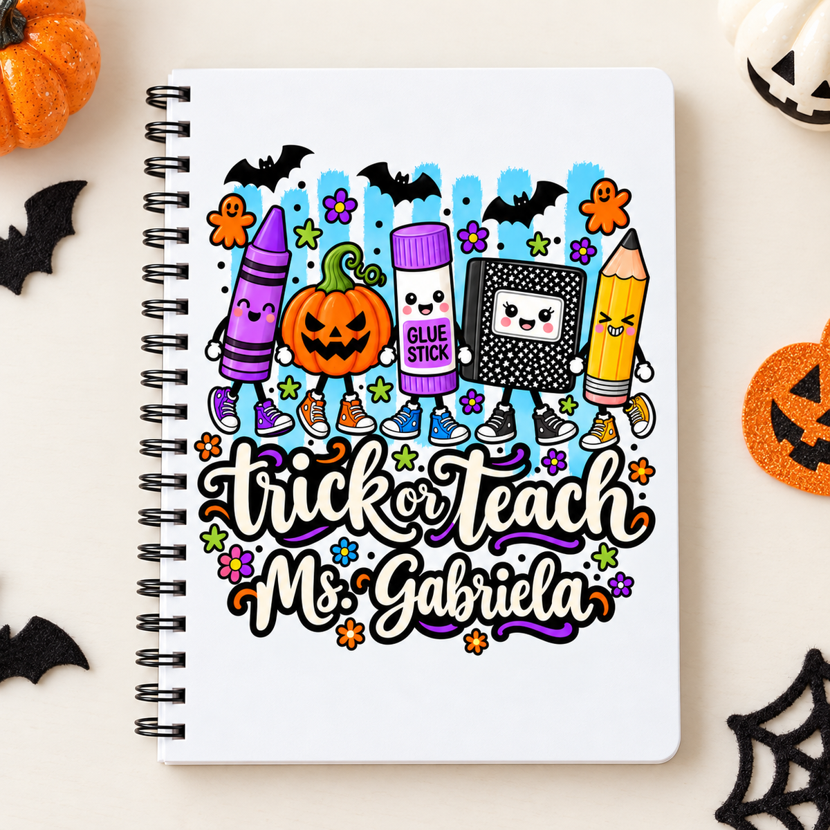 Square photo of the full personalized trick or teach teacher notebook; sample name shown