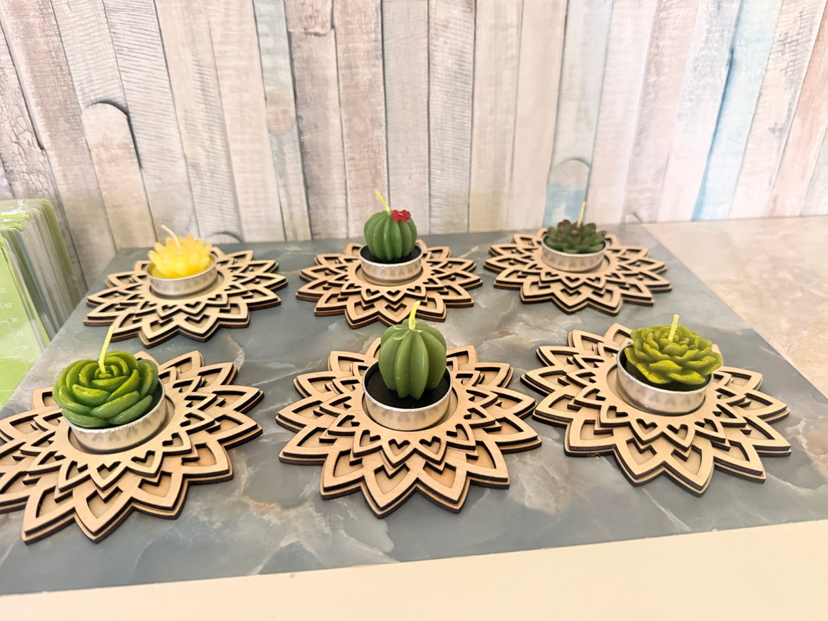 Angled view of wooden mandala tea light holders with optional succulent candles