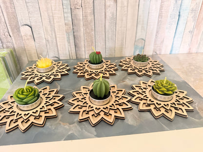 Angled view of wooden mandala tea light holders with optional succulent candles