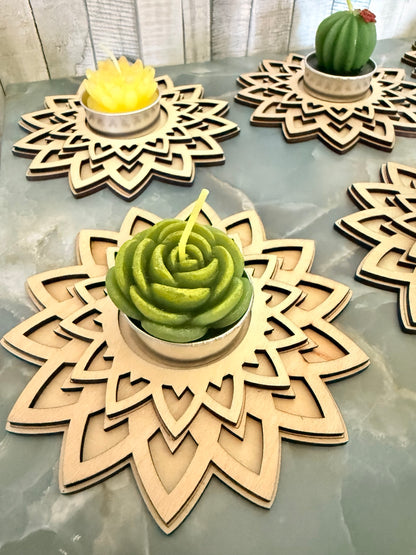 Close-up of a green succulent-shaped candle in a layered wooden mandala holder; succulent upgrade costs $1.50 extra